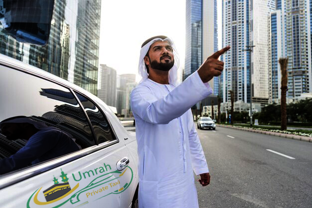 Beautiful view of Masjid al-Nabawi in Madinah at night with umrah private taxi